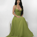 Model showcasing the Verdant Maxi Dress by Lauven, featuring a lace bodice and pleated olive green skirt.